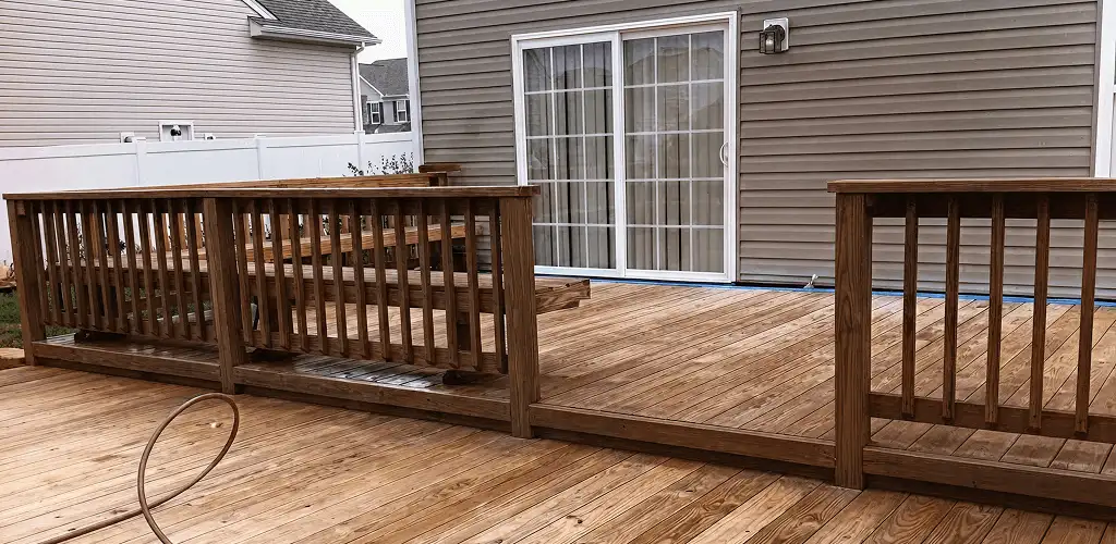 Deck sealing service protecting a backyard wood deck and railings in Sacramento, CA