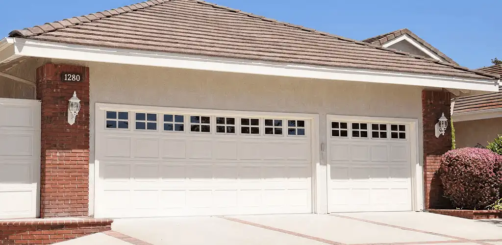 Residential garage door repair service for a double garage door in Sacramento, CA