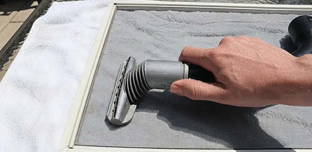 Window screen repair cleaning and fixing a damaged screen mesh in Sacramento, CA