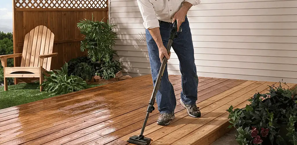 Deck staining service applying stain to a backyard wood deck in Sacramento, CA